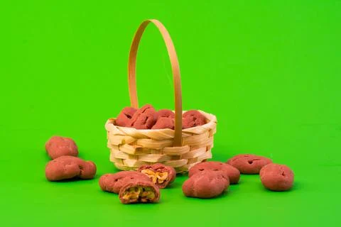 Pecan in white chocolate on a green background. Packaging, chromakey, adverti Stock Photos