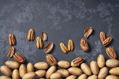 Pecans on black table, with copy area. View from above Stock Photos