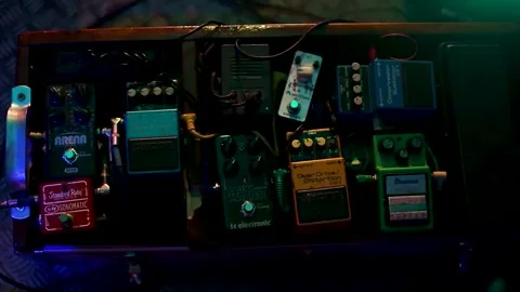 Pedalboard illuminated by colored lights Stock Footage