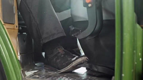 Pedals control the tractor's throttle and brake while driving. Stock Footage 270060889