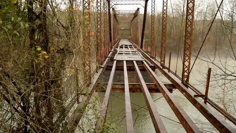 Pedestal down shot left side of bridge over river. Stock Footage 85801146