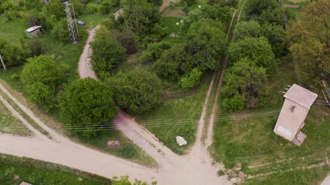 Pedestal drone shot moving down on the village of Tsarichina Hole, a Stock Footage 265988532