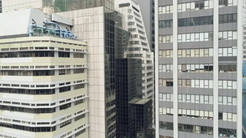 Pedestal move down, descend. Drone shot close to high rise buildings in Hong  Stock-Footage 172083891
