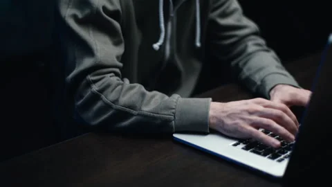 Pedestal shot of hacker man hacking web site or engaging hacking into security Video stock 145122008