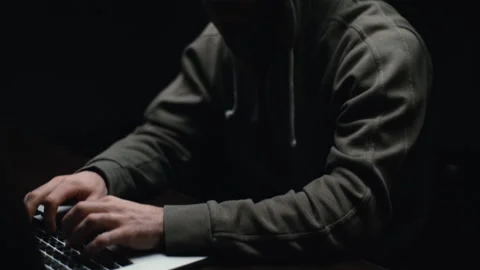 Pedestal shot of hacker man hacking web site or engaging hacking into security Video stock 145122551
