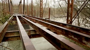 Pedestal up shot of right side of bridge over river. Stock Footage 85801077
