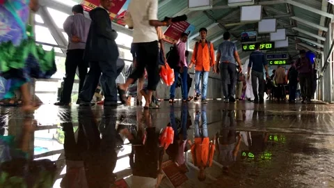 Pedestrain waking on the bridge reflecting through water | Mumbai Stock Footage 272612714