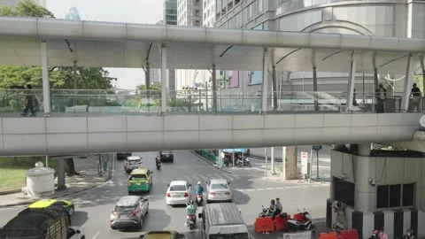 Pedestrian bridge above an intersection in downtown Bangkok, Thailand Stock Footage 245008304