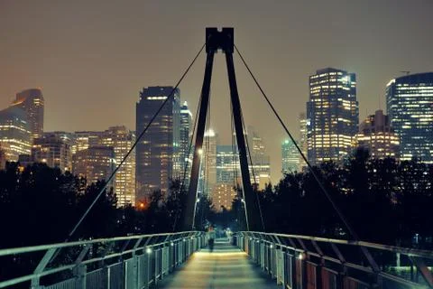 Pedestrian bridge and downtown skyscrapers at hight in Calgary, Canada. Stock Photos