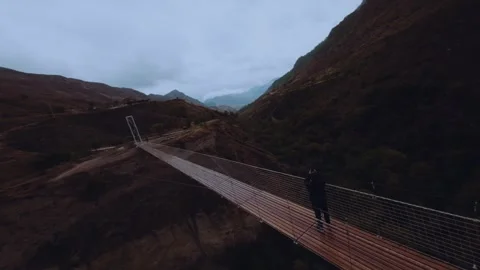Pedestrian bridge between the mountains Stock Footage 263139926