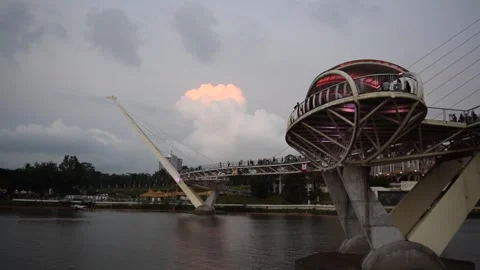 Pedestrian bridge with colourful lighting and people in Kuching Malaysia. Video stock 333282784
