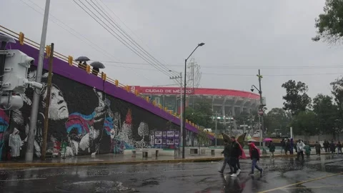 A pedestrian bridge to Estadio Azteca in the rain Stock Footage 345278469