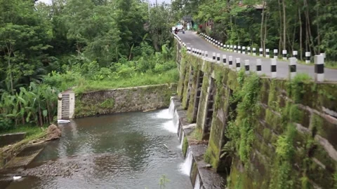A pedestrian bridge in rural Yogyakarta, Java, Indonesia. Stock Footage 223286397