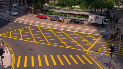 PEDESTRIAN CROSSING BUSES TRAMS CENTRAL HONG KONG Stock Footage 67025343