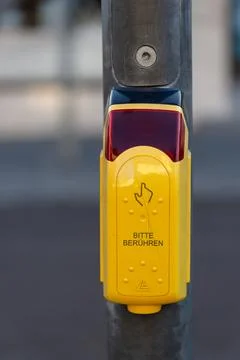 Pedestrian crossing button in city with please touch sign Stock Photos