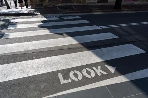 Pedestrian crossing: Look right first Stock Photos