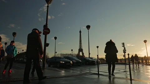 Pedestrian crossing in Paris, Eiffel tower in background Stock Footage 128273991