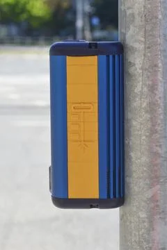 Pedestrian crossing push button on traffic light pole Stock Photos