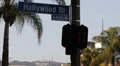 Pedestrian Crosswalk Hollywood Sign Los Angeles Traffic Light Illuminated Hand HD Footage