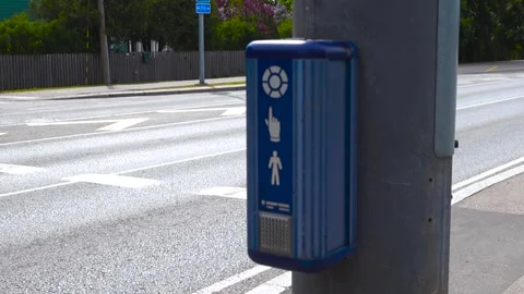 Pedestrian Crosswalk Push Button with Blinking Light at an Intersection Stock Footage 336767858