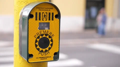 Pedestrian light button pressed at crosswalk to trigger green signal 스톡 동영상 320257162