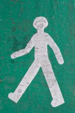 Pedestrian logo in perspective on a road Stock Photos