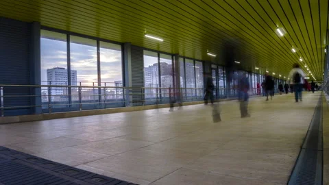 Pedestrian motion along transparent bridge time lapse, Stock Footage 88564517