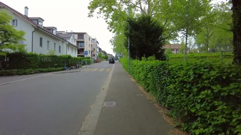 Pedestrian path along modern apartment buildings and crosswalk in Zurich Stock Footage 334632983