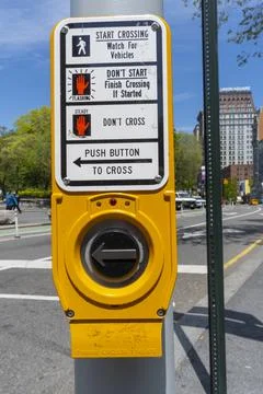 Pedestrian push button crossing direction arrow placed around Union Square NYC. Stock Photos