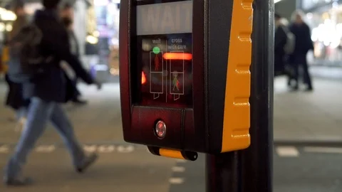 Pedestrian pushes button and waits for the green sign at a crossing Stock Footage 100608686