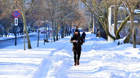 Pedestrian on a snow-covered Stock Photos