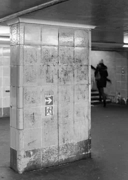 A pedestrian on a staircase in the subway station Foto stock