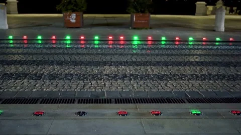 Pedestrian traffic guiding system on the ground turning from red to green at Stock Footage 273286094