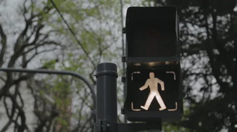 Pedestrian traffic light going from walk to don't walk Stock Footage