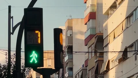 Pedestrian traffic light on green with a countdown timer for crossing Video stock 346804464