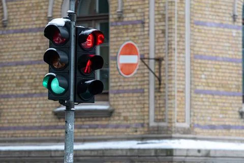 Pedestrian traffic light with a timer on the background of the building, clos Stock Photos
