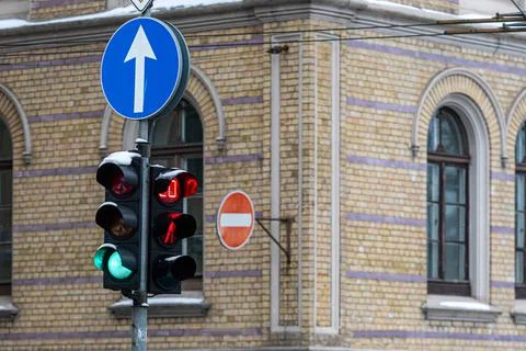 Pedestrian traffic light with a timer on the background of the building, clos Stock Photos