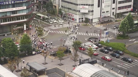 Pedestrian traffic of people crossing the intersection at Kyoto Station, Japan Stock-Footage 89842653