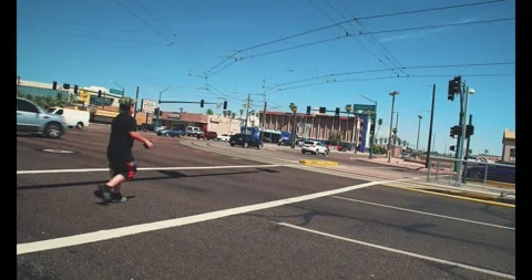A Pedestrian walking in the crosswalk. Stock Footage 316546904