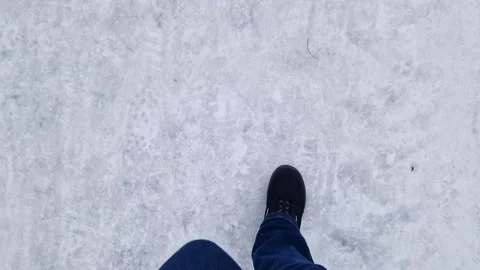 Pedestrian walking on ice on sidewalk in winter Stock Footage 346373651