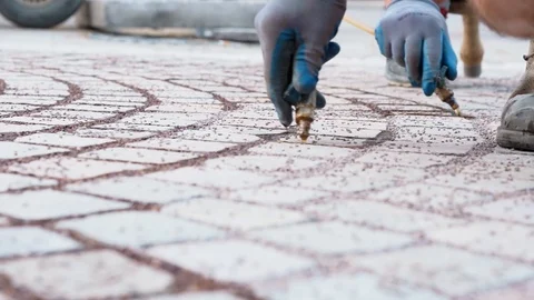 Pedestrian Walkway Hand Close Up Making Process Worker Applying Glue on Sand Vídeo Stock 127621323