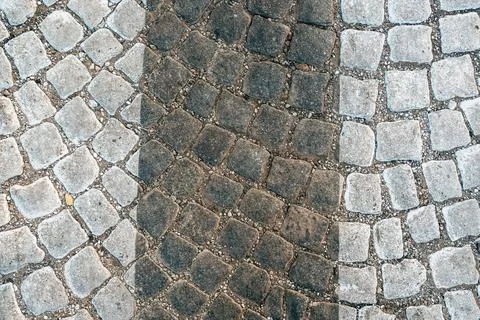 Pedestrian zebra crossing pattern on cobble stone road Stock Photos
