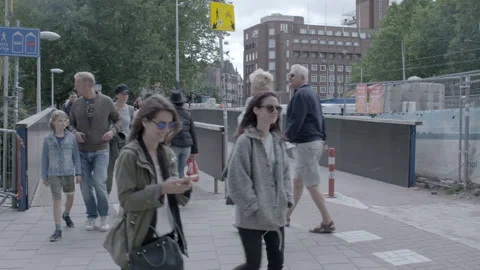 Pedestrians and Cyclists Crossing an Urban Bridge Stock Footage 344603353