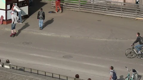 Pedestrians and rollers 動画素材 97899699