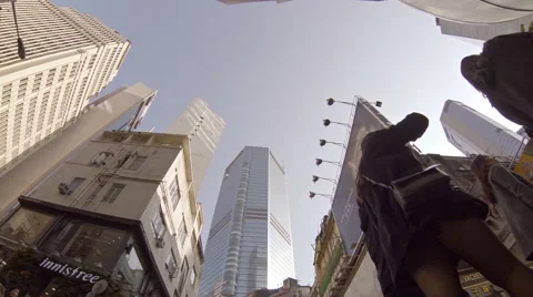 Pedestrians and shoppers walking down a street in the commercial district Stock Footage 59883605