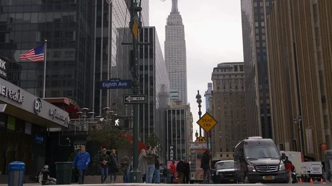 Pedestrians And Traffic Commuting On Impressive Iconic New York Skyscrapers  Stock Footage 114044763