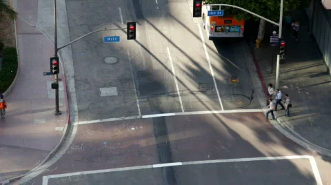 Pedestrians cross an intersection Stock Footage 826621