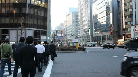 Pedestrians cross an intersection in the Ginza district. Stock Footage 25821810