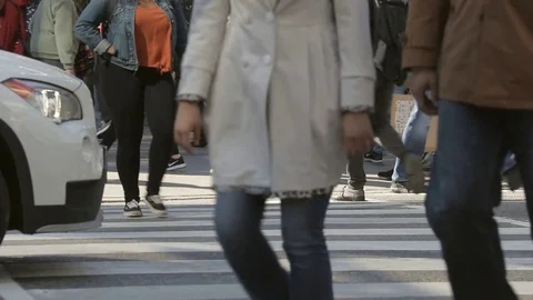 Pedestrians crossing busy intersection Stock Footage 72231849