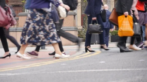 Pedestrians crossing at a busy intersection Stock Footage 98186846